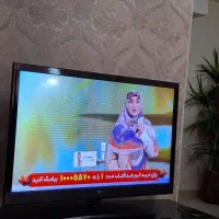 فروش تلویزیون ال جی ۴۲ اینچ به همراه میز تلویزیون|تلویزیون و پروژکتور|هشتگرد, فاز ۲ مهستان|دیوار