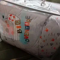 ست رختخواب و قنداق نوزاد