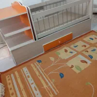 تخت دو منظوره و فرش وساعت