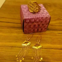 گوشواره و انگشتر طلا 200 بالای تابلو