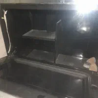 اجاق گاز و کباب پز و میز تلویزن