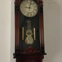 ساعت دیواری آونگ دار