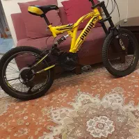 دوچرخه زرد قناری پوما دنده ای کمک فنردار