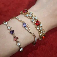 دستبند زنانه مجلسی استیل طلایی با نگین رنگی