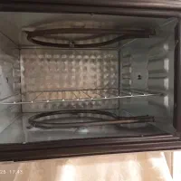 توستر  درحد نو زیاد استفاده نشده رنگ طوسی