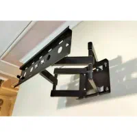 پایه دیواری تلویزیون در حد نو معمولی و دو‌ بازو