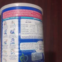 قوطی خالی شیرخشک و شیشه ویتامین سی