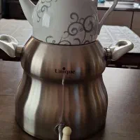 ست کتری و قوری مارک یونیک و یک دست فنجان پایه دار