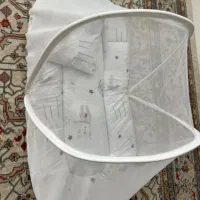 پشه بندبچه نونو به همین مدل فقط عکسش تخ شاخه