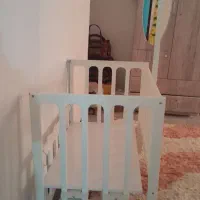 گهواره نو کنار تخت مادر