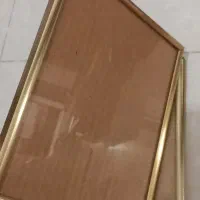 تعدادی قاب عکس یا تابلوی چوبی و فلزی و pvc با شیشه