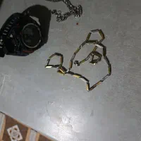 ساعت و گردنبند و دست بند