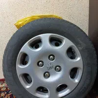 ۴ حلقه لاستیک با رینگ و قالپاق پژو