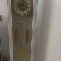 ساعت ایستاده و چند تیکه وسایل منزل