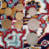 تعدادی سکه و اسکناس شاهی و ایرانی