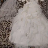 لباس عروس همراه با کت و تور سر