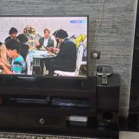 یک عددتلوزیون ال جی سالم همراه سینما خانواده و میز