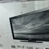 تلویزیون LCD ومدل 14اینچ پارس قدیمی و میز  شیشه ای