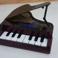 عروسک دختر پیانو اسباب بازی قدیمی