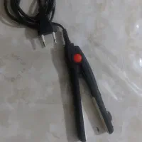 یک عدد اتوی موی مسافرتی