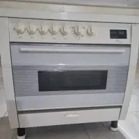 اجاق گاز فردار صفحه تایمردار و جوجه گردان تکنو