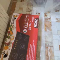 اجاق گاز رومیزی و ماکروفر و جارو