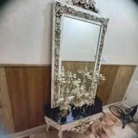 اینه به همراه شمعدانی وساعت
