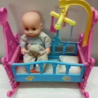 گهواره اسباب بازی همراه با عروسک موزیکال