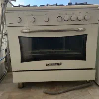 اجاق گاز فر دار رمگا (۵شعله جوجه گردان)