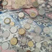 مقداری سکه.نو و کارکرده