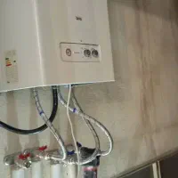 تاسیسات ساختمان تعمیرات پکیج و ابکرمکن ....