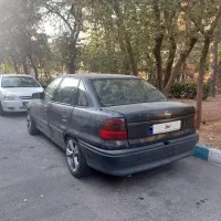 اپل آسترا سدان مدل ۱۹۹۵ مشکی اتاق سالم روپا
