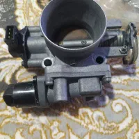 دریچه گاز و مقداری وسایل نیسان وانت