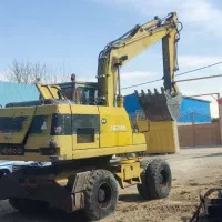 بیل مکانیکی لاستیکی اچ100 معاوضه با کمپرس