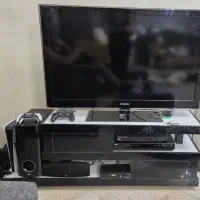 تلویزیون و میز و سینما خانگی