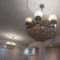 لوستر  و ساعت و میز برنج
