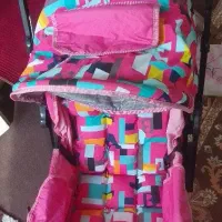 کالسکه روروئک.سه چرخه قنداق سوییسی وکیسه خواب هدیه