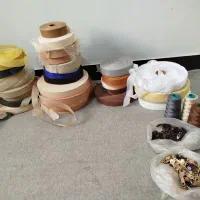 تعدادی نوار گان، زیپ، سر زیپ، نخ،پایه گان