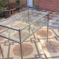 میز شیشه ای دو طبقه پایه استیل