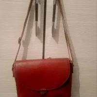 کیف و کفش چرمی رنگ‌ زرشکی درحد نو