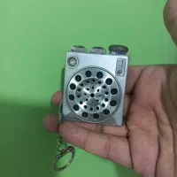 رادیو مینیاتوری کوچک و ساعت کوکی رو میزی