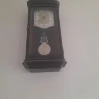 بوفه ساعت زیر تلویزیون