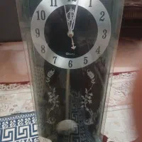 ۲ عددساعت دیواری زیبا و درب دار دارای پاندول حرکتی