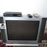 تلویزیون ۲۱ با میز شیشه ای و کنترل بدون دیجیتال