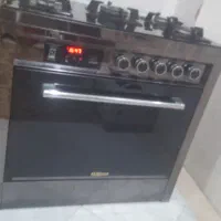 اجاق گاز 5 شعله صفحه شیشه ایی تایمر و فندک دار