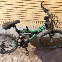 دوچرخه پوما و کلاه ایمنی اسکیت