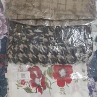 تعدادی شال  روسری شومیز و یک قواره پارچه
