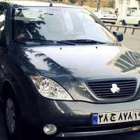 راننده با خودرو ‌تاکسی تیبا ۲۰۶ کوییک طرح دار