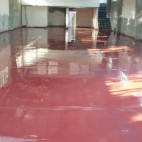 بتن ریزی با ماله پروانه و دوربین لیزری