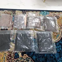 ترمه و پارچه مشکی روی میز و جنازه